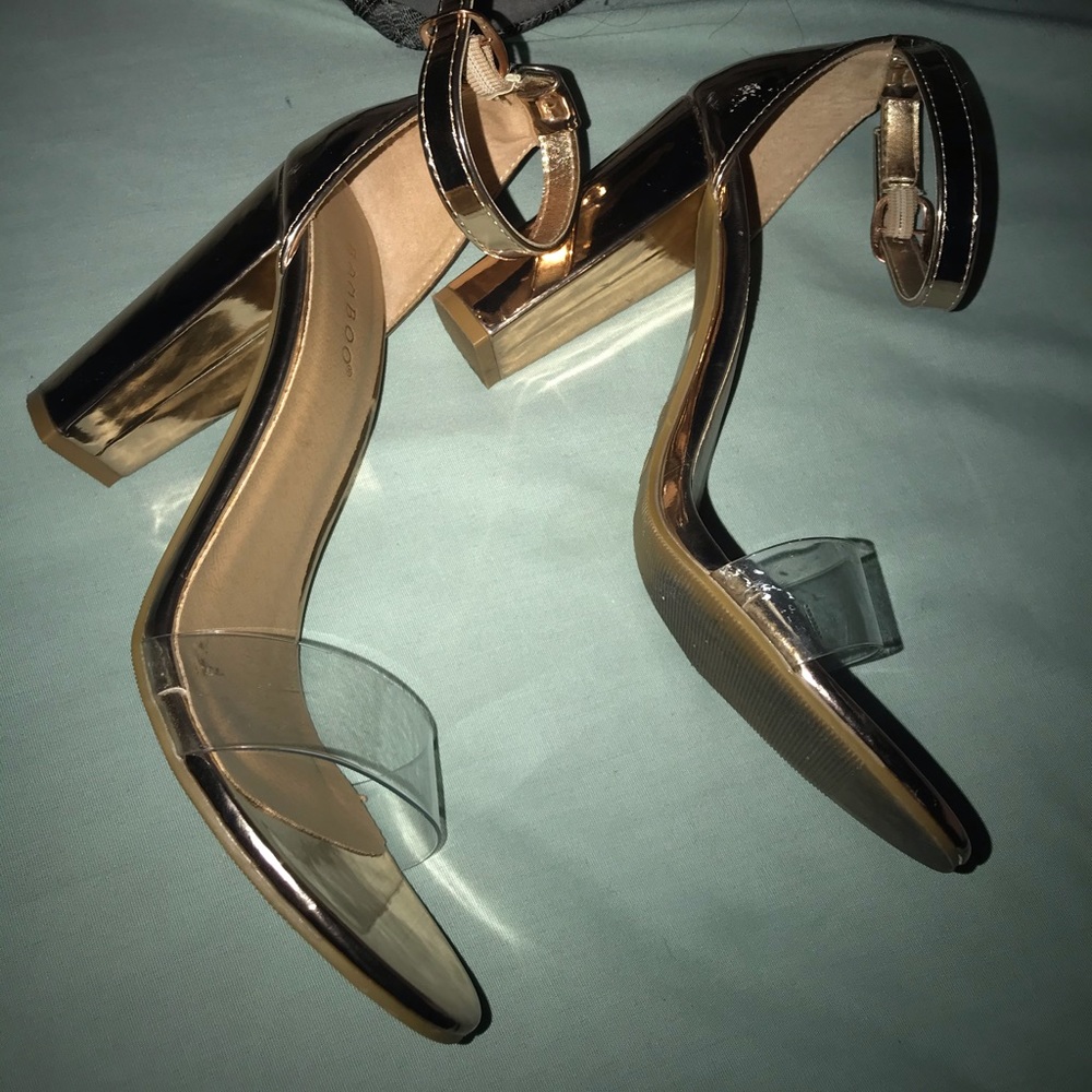 Gold block heels with clear front strap . SO CUTE